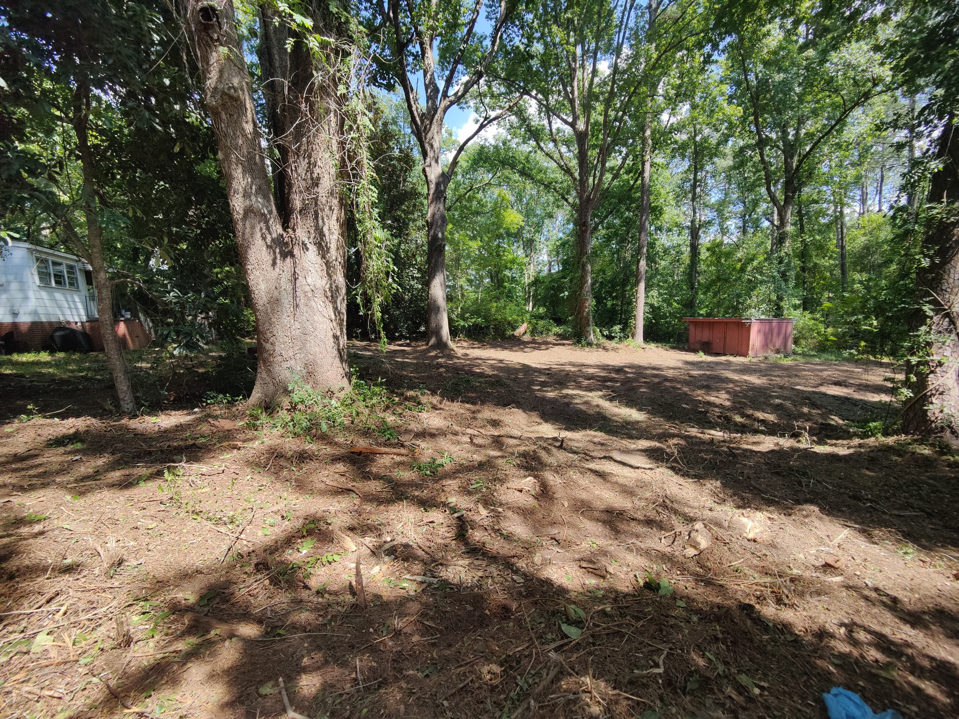 Field and yard opening near a barn after land clearing